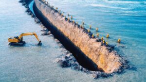 イスラエルはアジアに到達するために、地中海から何トンもの砂を掘り出している